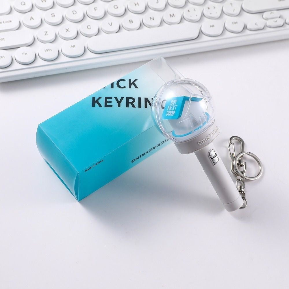 BOYNEXTDOOR mini light stick keychain displayed beside its blue box