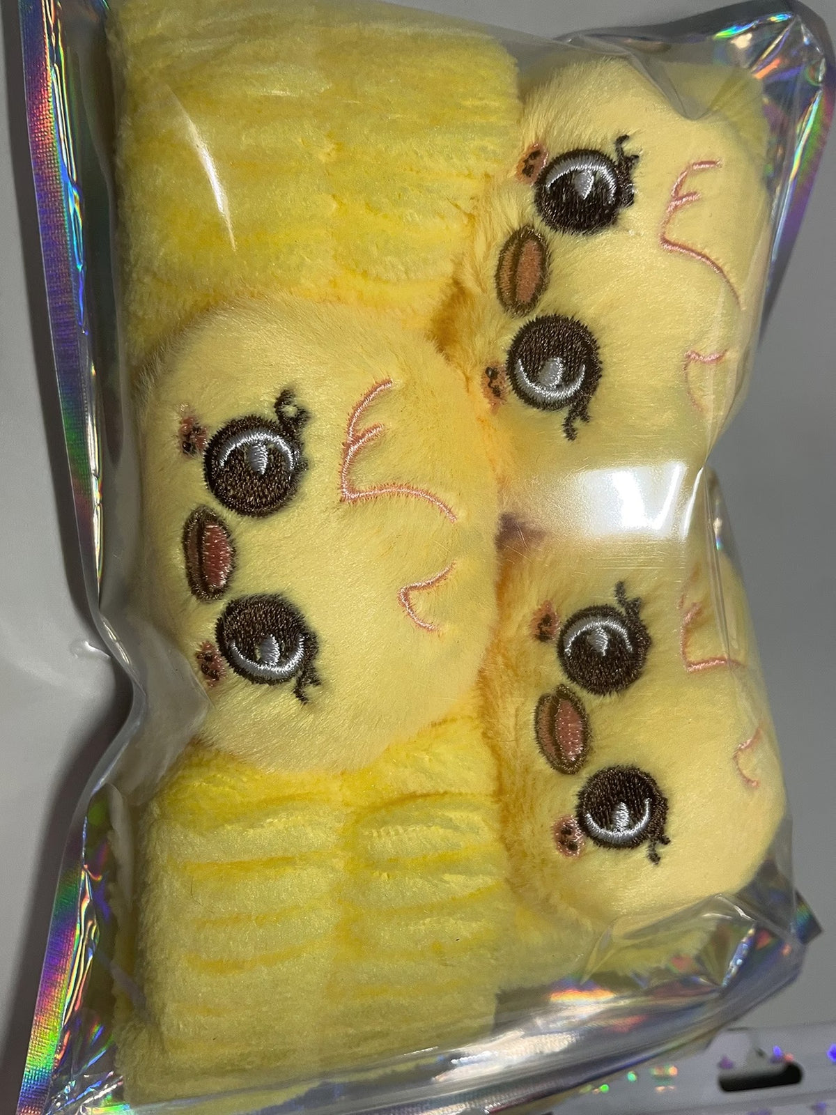 Yellow character plush headband and matching wristbands in package